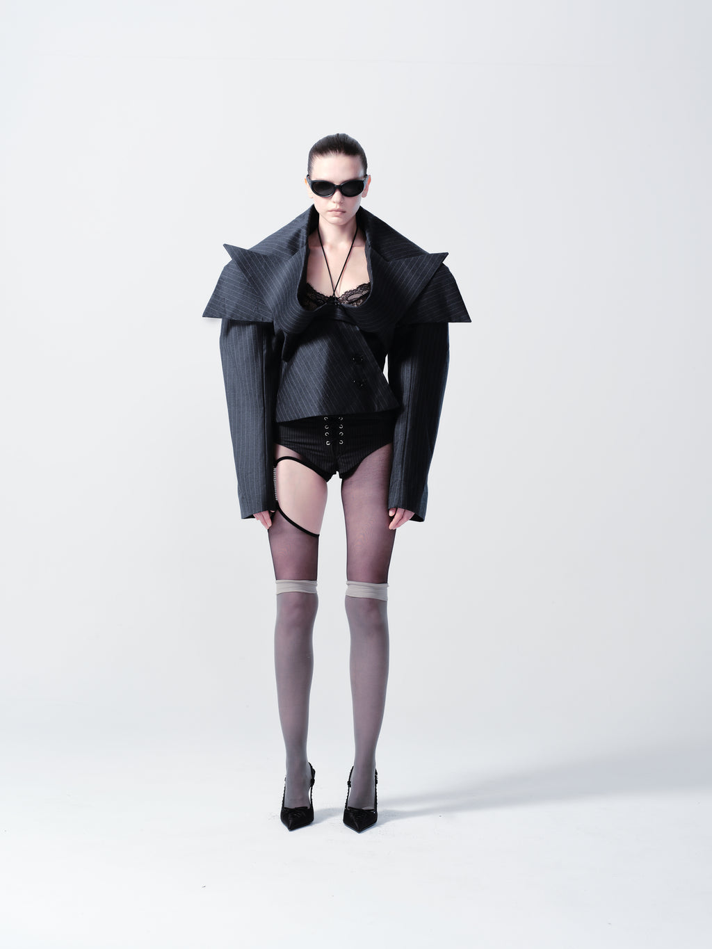 STRIPED SUIT BRIEFS WITH EYELETS AND LOCK